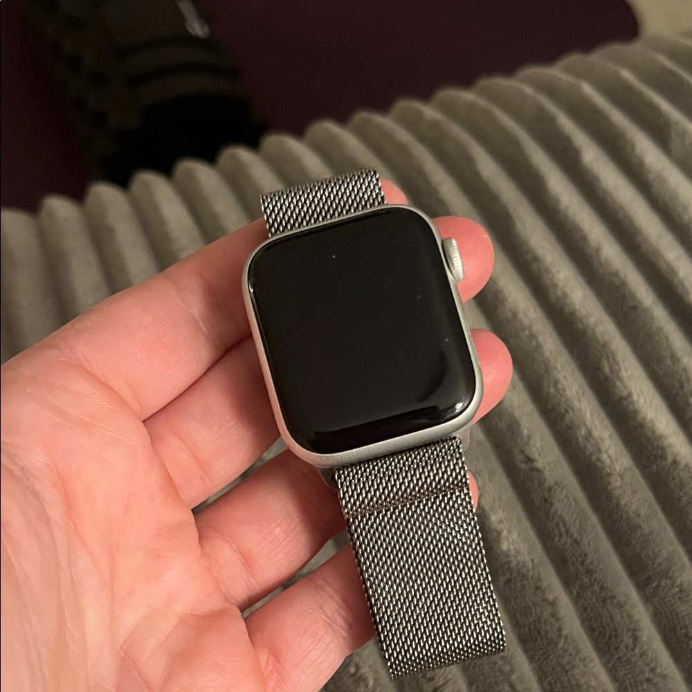 Apple Smartwatch with Black Display and Silver Mesh Band